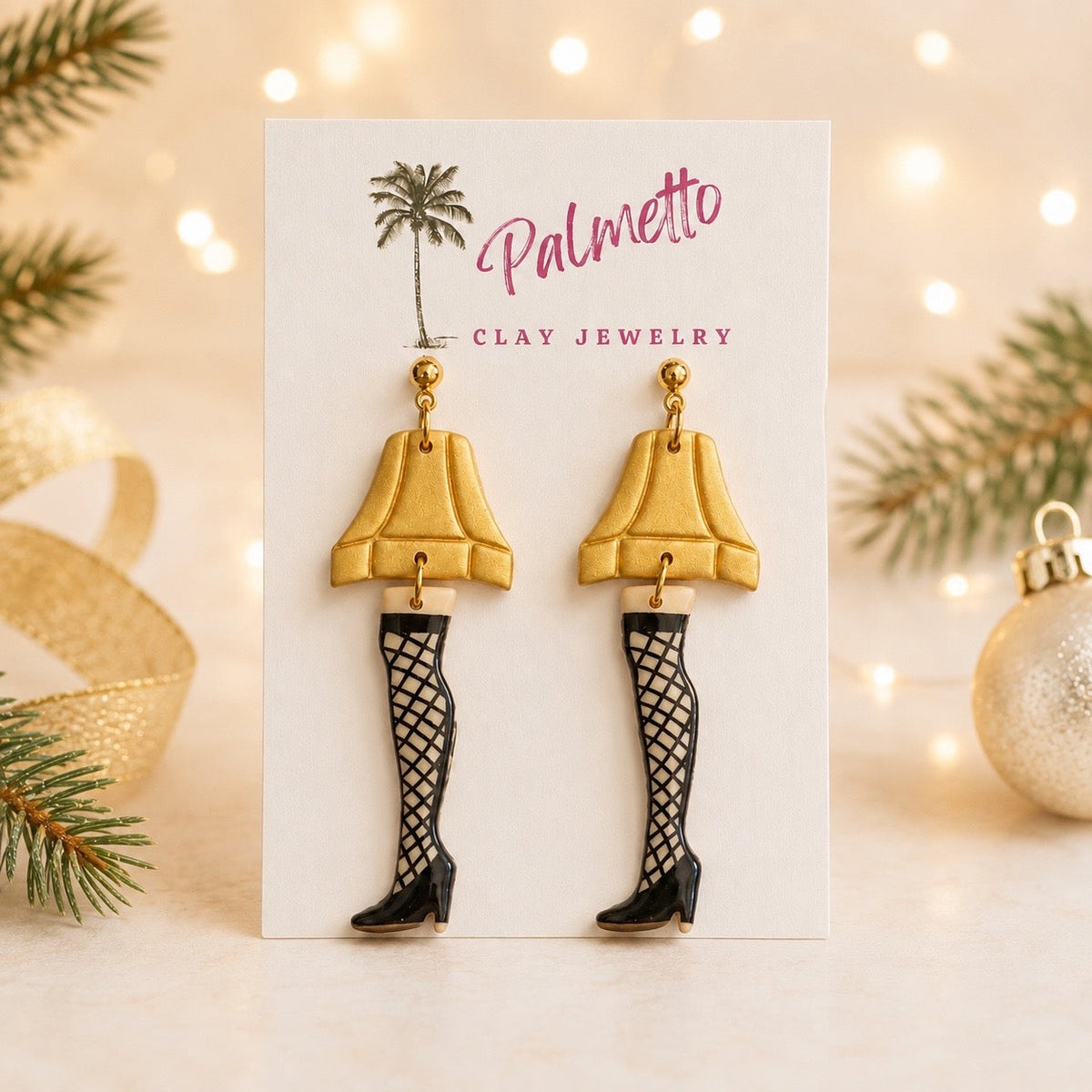 Handcrafted polymer clay Leg Lamp Christmas earrings with fringed shades, fishnet details and black heels on Palmetto Clay Jewelry display card