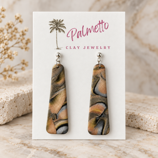 Long tapered marbled polymer clay earrings in bronze, caramel, gray and black with silver-tone ball posts from Palmetto Clay Jewelry.