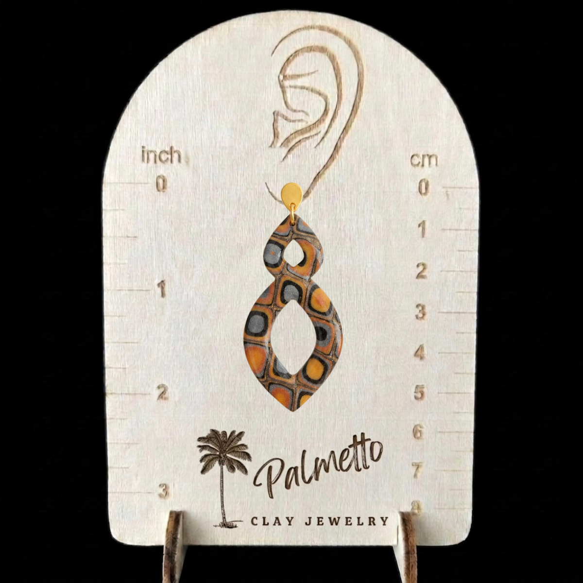 Hearthside metallic fall statement earrings shown on Palmetto Clay Jewelry size chart for scale